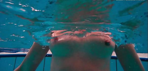  Alla Birtakik undresses nude in the swimming pool